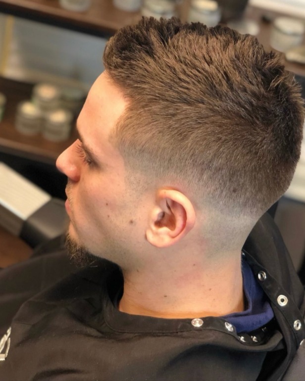 Fresh high taper with a textured top at ONE CHAIR · BARBER by Paul
